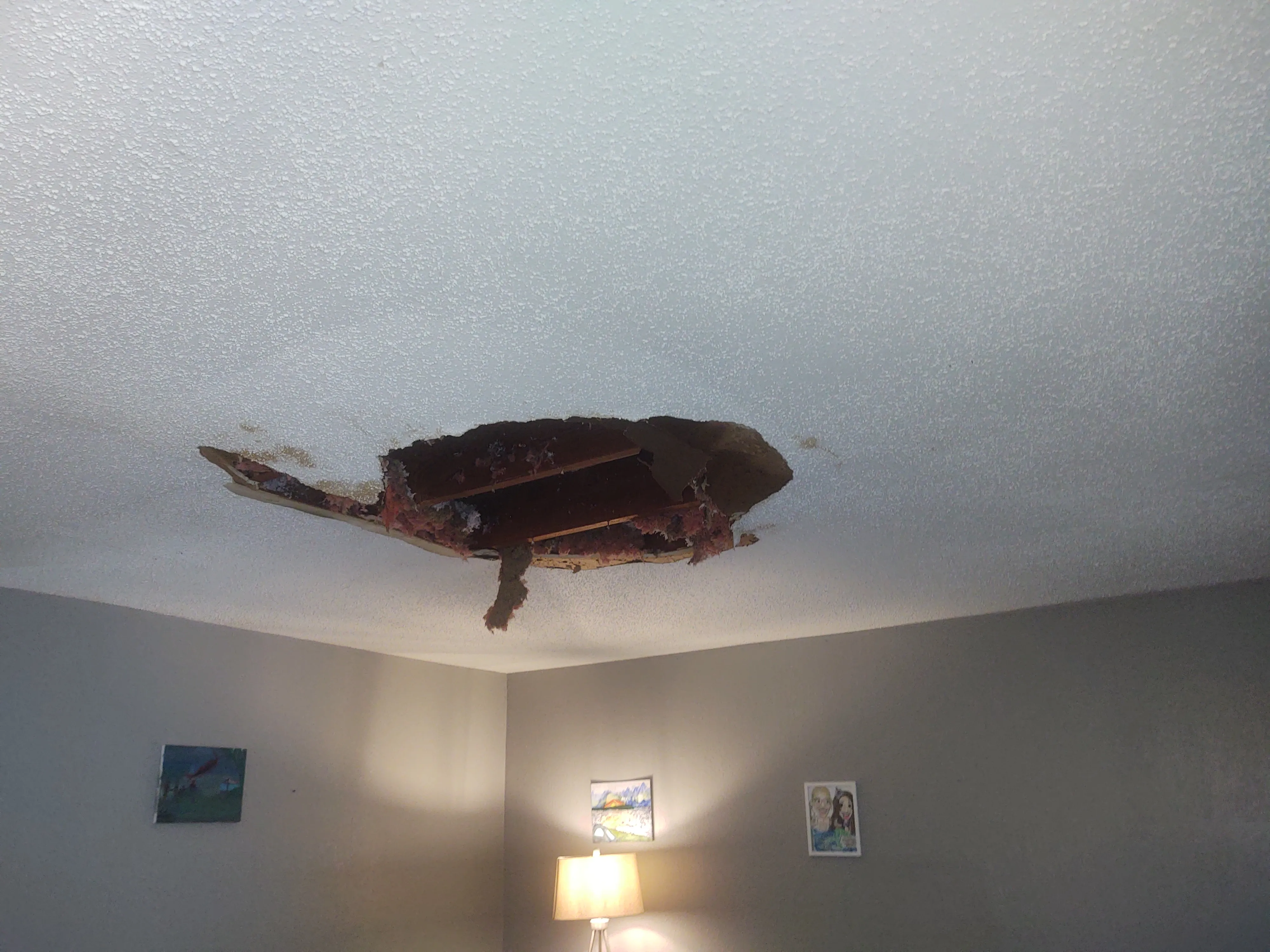 Before photo of ceiling collapse from water damage in a Tulsa home