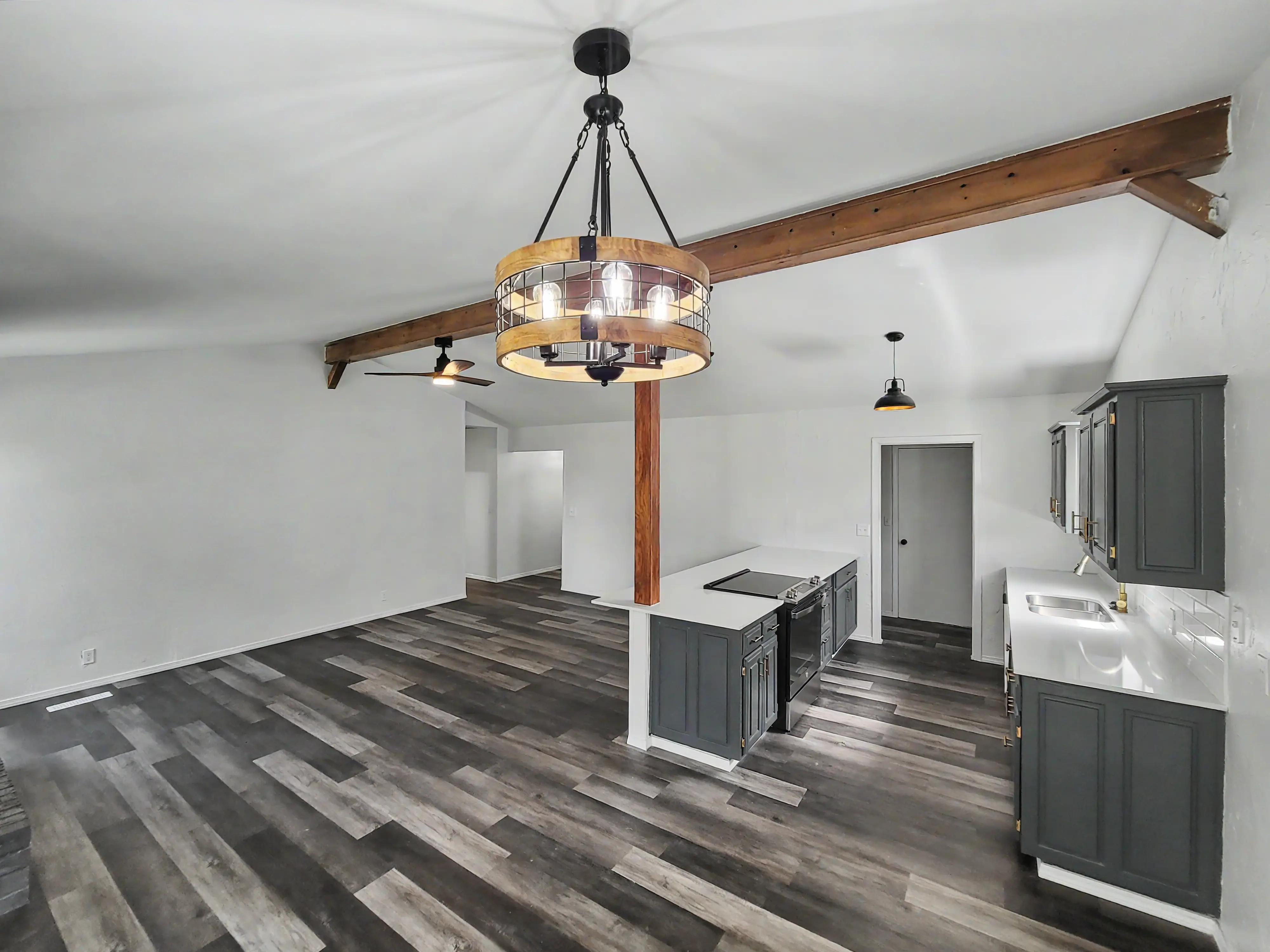 Open dining and living area remodel in Tulsa with upgraded flooring and improved room-to-room flow