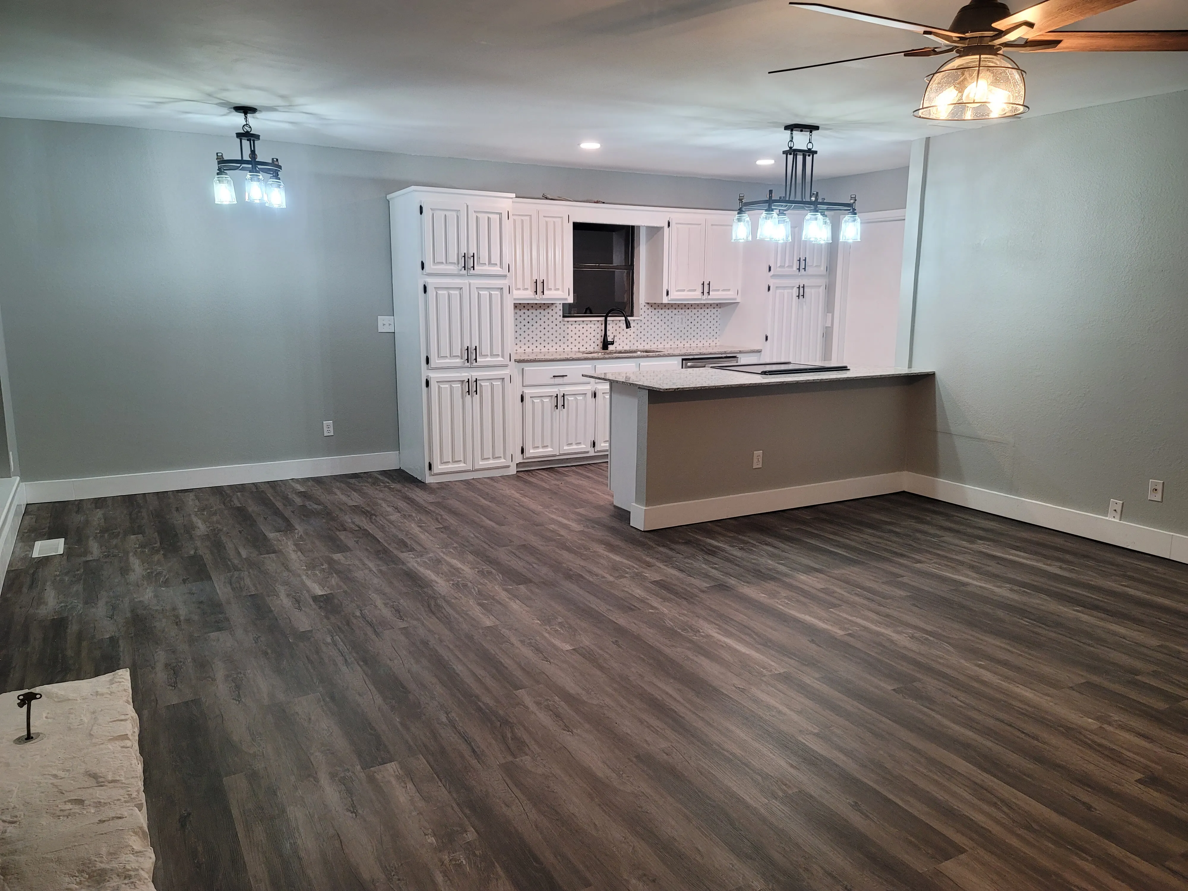 Kitchen after remodel with improved prep space and cabinet continuity