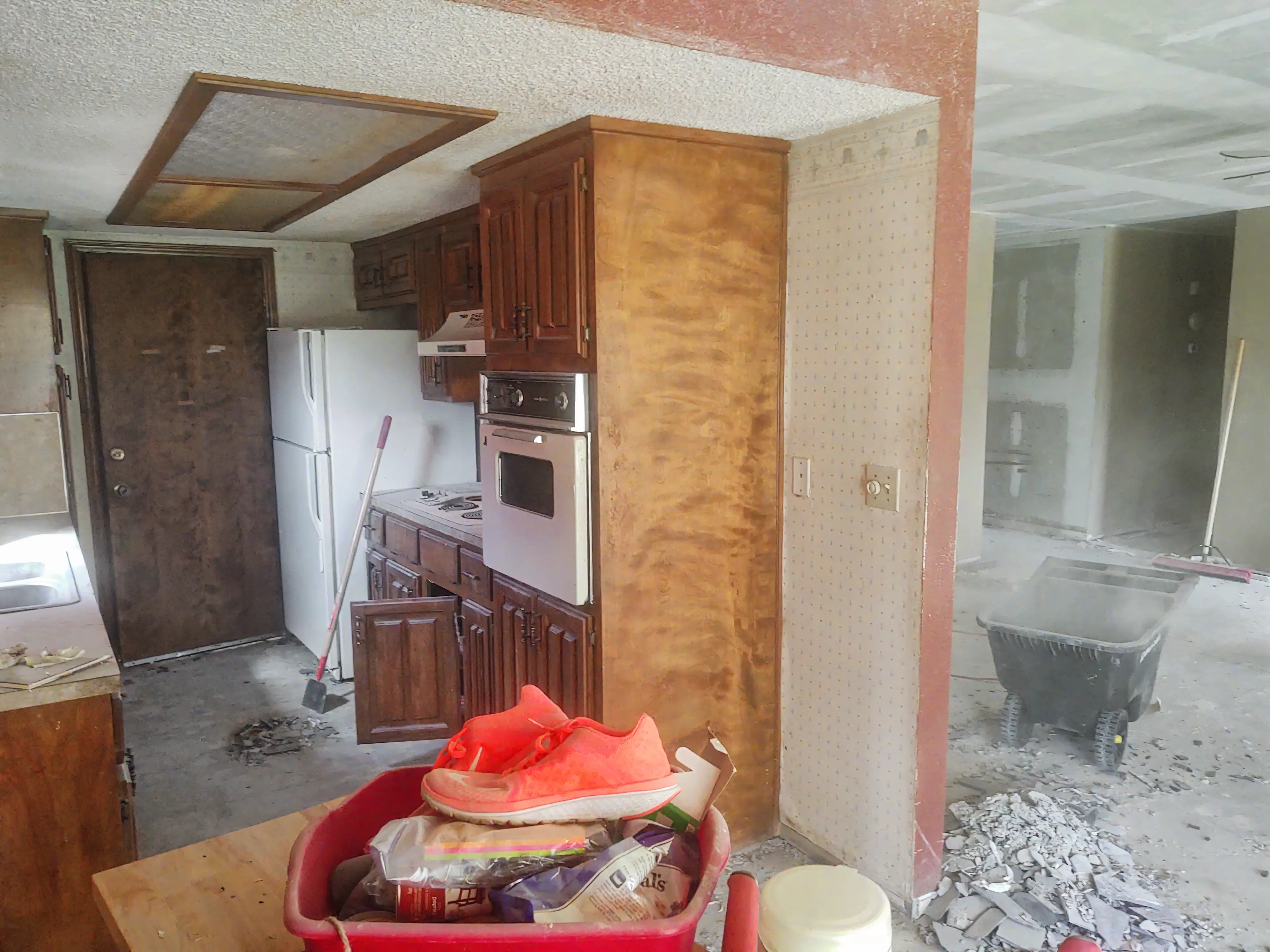 Before kitchen layout in Tulsa with darker finishes and tighter flow